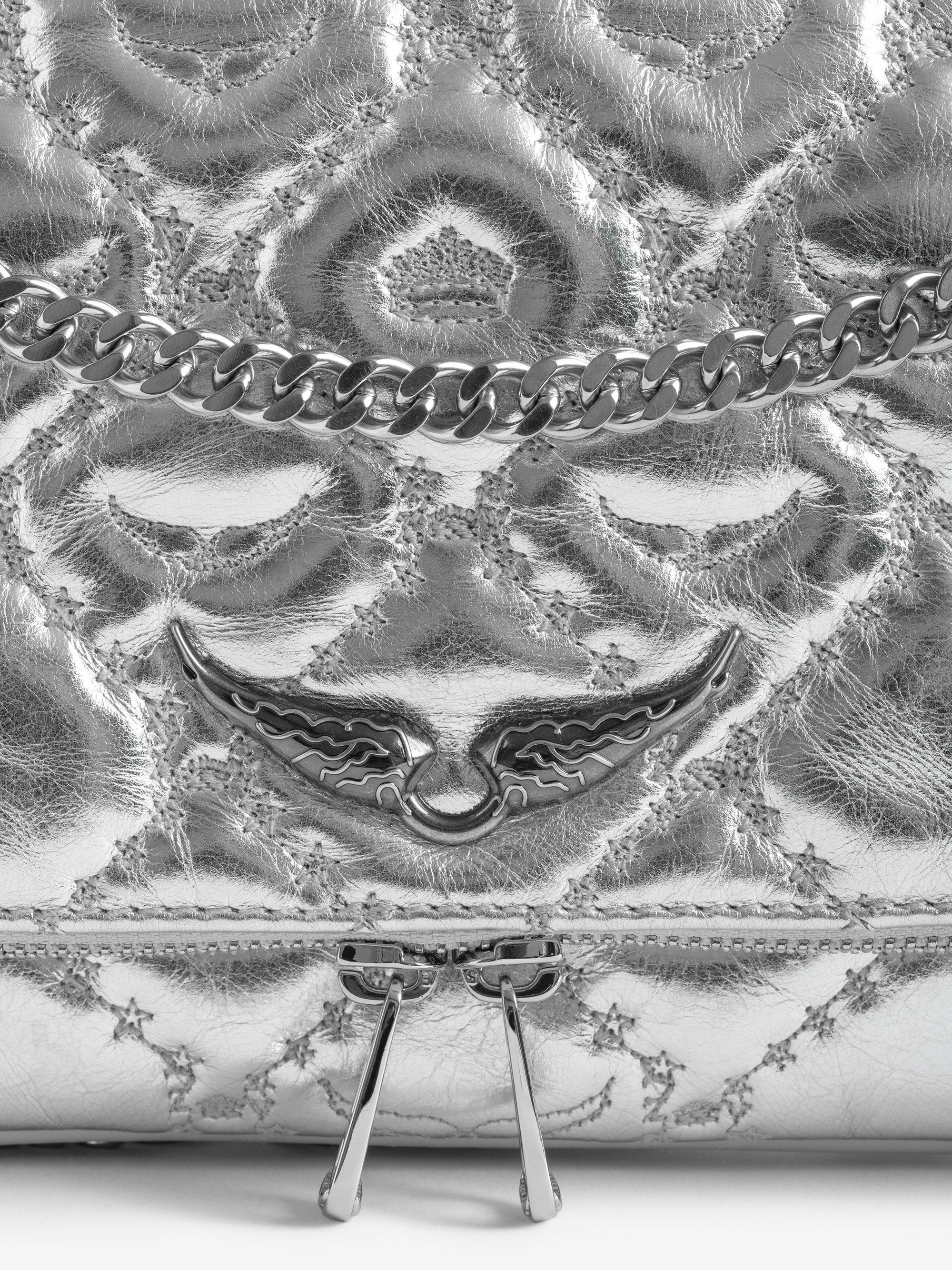 Rock II Metal Monogram Clutch - Pochette in quilted metallic leather with sliding metal chain and signature wings.